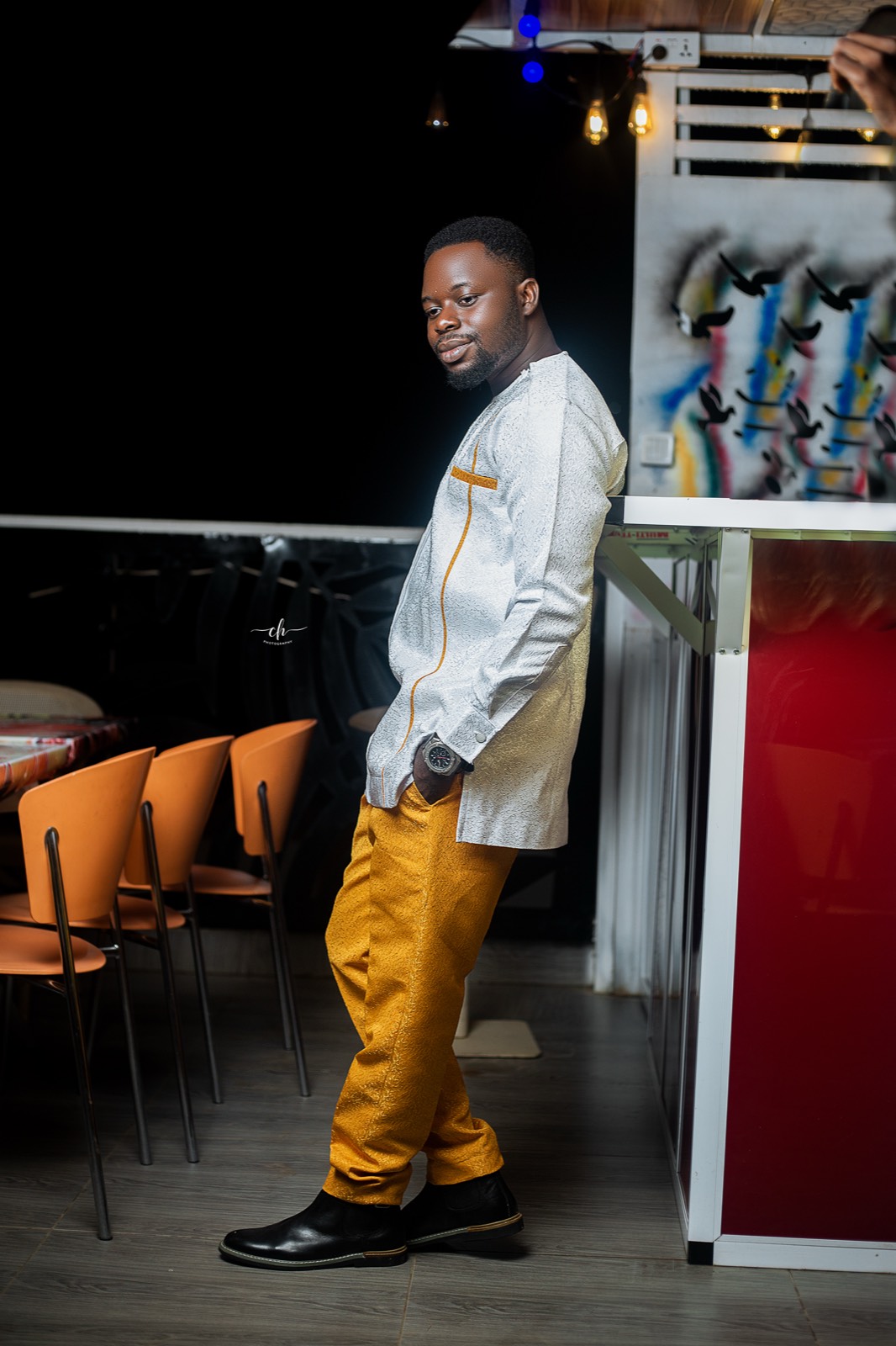 Oti Boateng Joseph, the groom, in white and gold attire